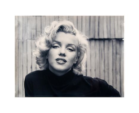 Black and white poster print on lustrous premium photo paper with POD substrate. Features Marilyn Monroe posing in a black tu