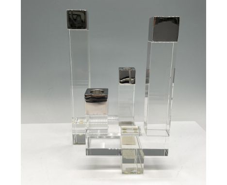 Four crystal modernist column spiers with stainless steel holder tops. Orrefors backstamp. This item has its original box: 9"