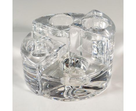 A set of 4 clear votive candle holders in various sized wedge pieces. Together the pieces form a circle. Orrefors marked. Tal
