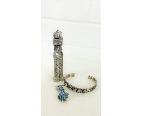 A mixed lot to include a silver bangle, silver and abalone brooch and a pewter figure, after Antoni Gaudi, (3) 