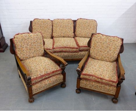 An Bergere suite comprising three seater sofa and pair of armchairs all with upholstered loose cushions (3) 
