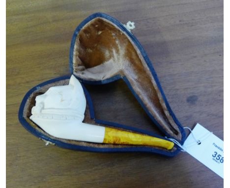 A carved meerschaum pipe, the bowl modelled as a cat head with a fitted case 