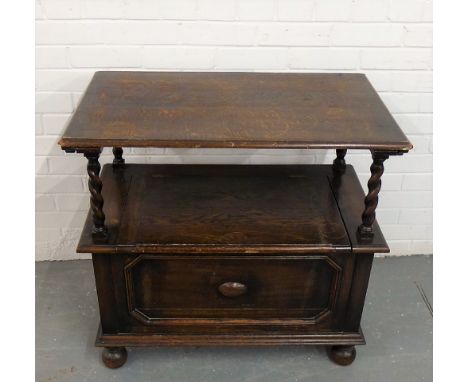 An oak monks bench, with barley twist supports and bun feet, 78 x 82cm