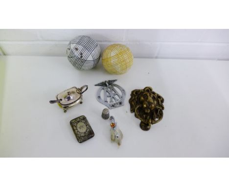 A mixed lot to include an AA badge, a brass door knocker, Epns vesta, thimble and mustard, a brooch and two carpet bowls (a l