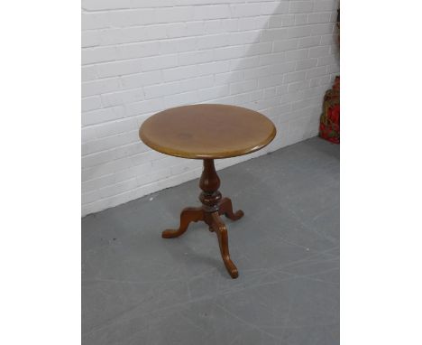 A mahogany wine table, the circular top on baluster column and tripod supports,  65 x 56cm