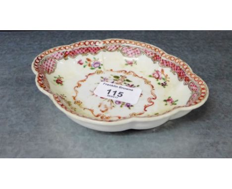 A Chinese porcelain scalloped dish with fish scale border and painted with floral sprays to the centre, 15 x 12cm