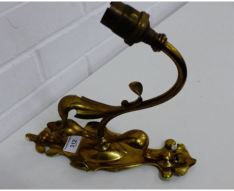 A brass Art Nouveau wall light, 27cm long