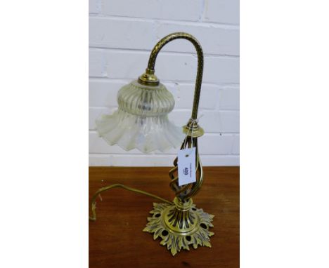 A brass table lamp with vaseline glass shade, 42cm high