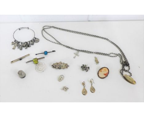 A mixed lot of mostly  silver and white metal bijouterie and jewellery to include brooches, charms, enamel pendant, necklaces