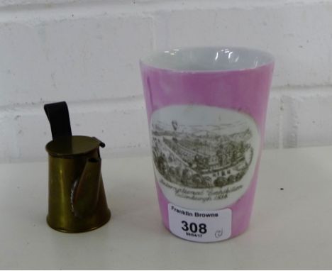 An International Exhibition of Edinburgh 1886 pink lustre porcelain beaker together with a small brass miners lamp, tallest 1