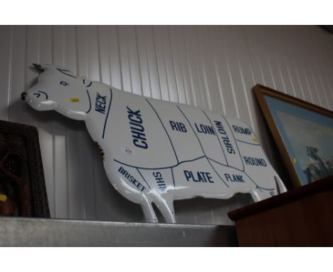 An enamel cow sign