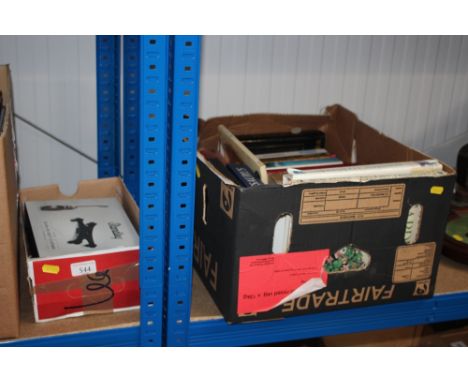 A box containing harmonicas, recorder, music holders etc