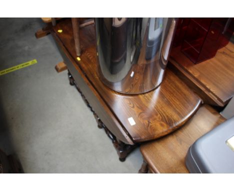 An elm gate leg drop leaf table