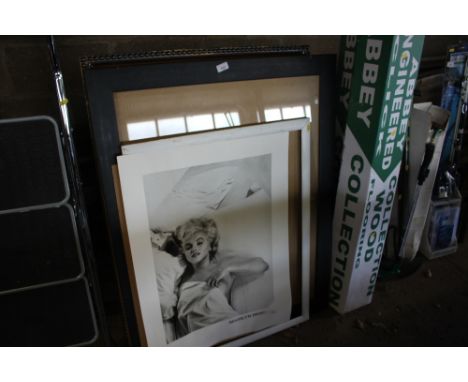A mirrored frame; together with Marilyn Monroe print etc