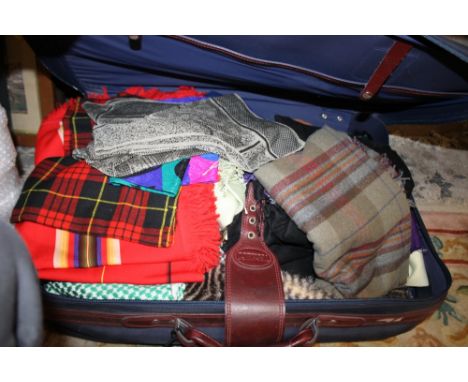 A SUITCASE OF ASSORTED TEXTILES ETC