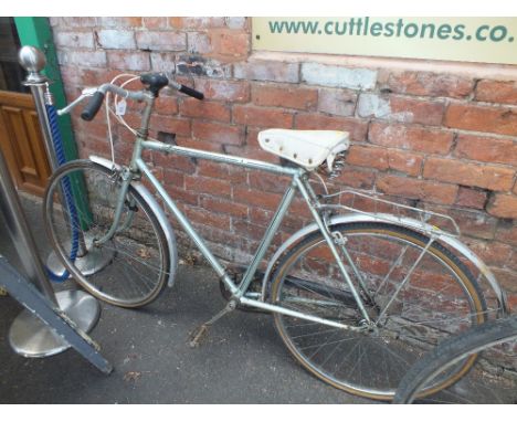 A SILVER VINTAGE RALEIGH BICYCLE