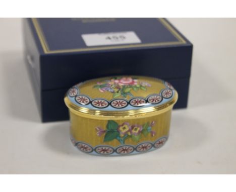 A BOXED HALCYON DAYS ENAMEL BOX, of oval form, with all over gilt and floral decoration inspired by an original example made 