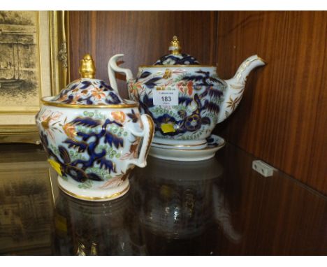 AN ANTIQUE IMARI TYPE TEAPOT AND STAND PLUS LIDDED SUCRIER