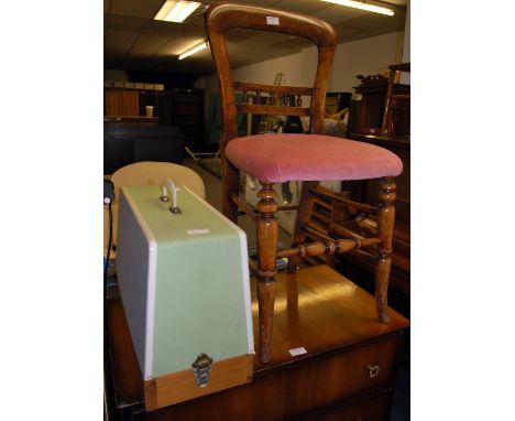 An antique bedroom chair, a 1950s four drawer chest of drawers, a modern brassed metal up-lighter and a sewing machine