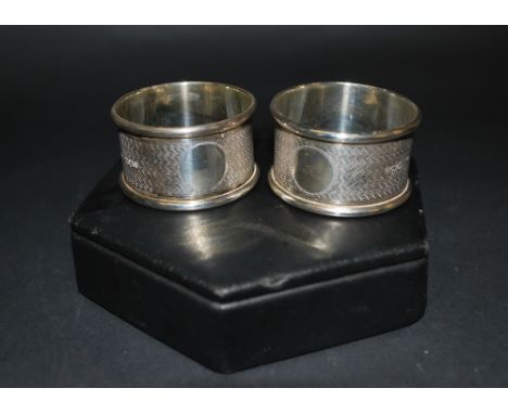 A pair of Walker and Hall hallmarked silver napkin rings