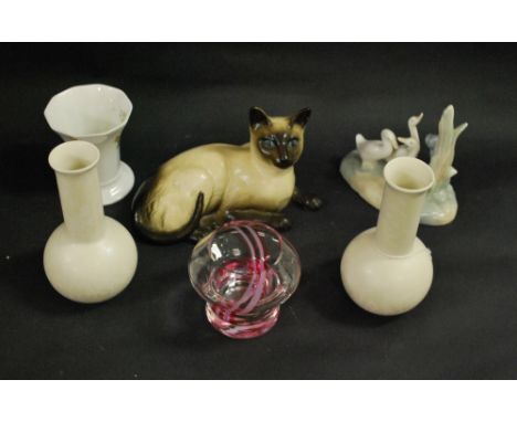 Named ceramics and glass, to include a Nao figural group, a pair of Poole vases, a coloured Caithness candle holder, a Royal 