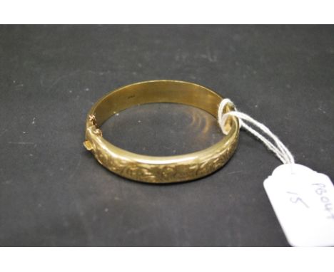 9ct gold snap bangle. Weight approximately 18g.