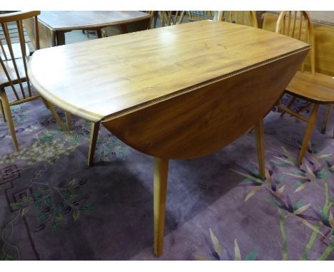 An Ercol Blonde drop-leaf table