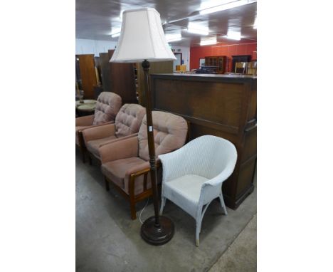 A beech standard lamp and a Lloyd Loom wicker armchair