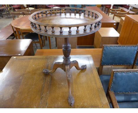 A Chippendale Revival mahogany and yew wood tripod wine table