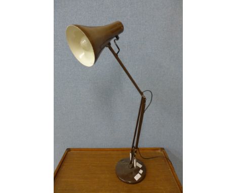 A brown metal anglepoise lamp