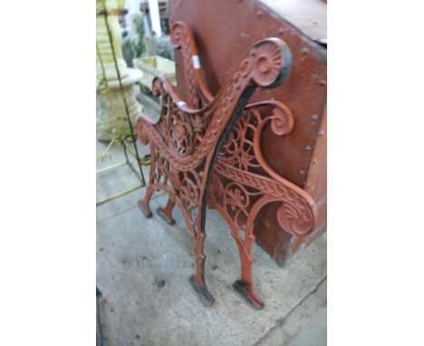 A pair of painted cast iron bench ends