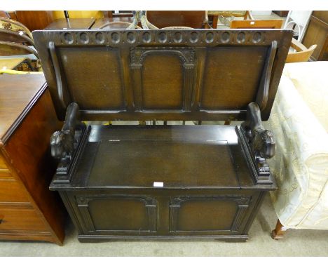 A carved oak monk's bench
