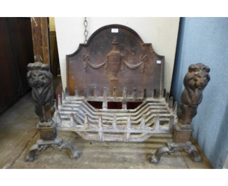 A cast iron fire grate and andirons