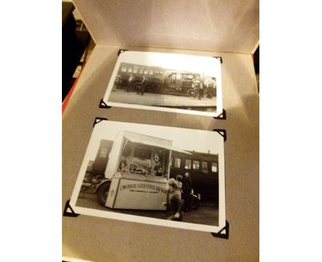 Two albums of black and white steam train and traction engine photographs 