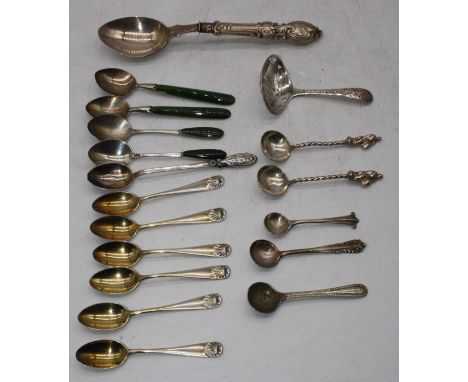 A George III silver caddy spoon, having bright cut engraved decoration; together with various silver and white mental teaspoo