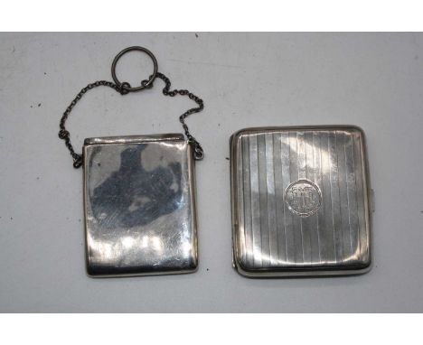 A George V silver pocket cigarette case, having engine turned decoration and monogrammed cartouche; together with a George V 