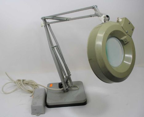 A 20th century angle poise magnifying table lampGlass is in tact, small surface marks and scratches.The metal and plastic ele