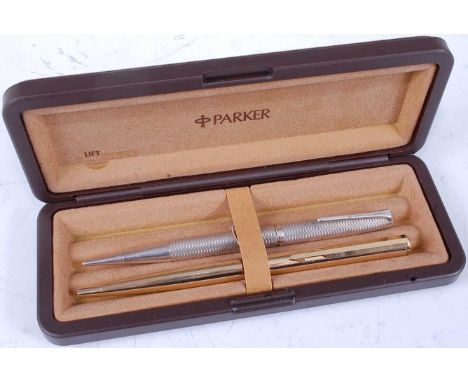 A Parker ballpoint pen; together with a yard-'o-lead engine turned propelling pencil, in associated fitted Parker case 