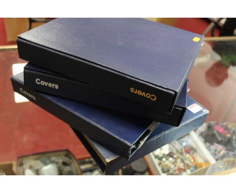 Three albums containing a collection of first day covers, mainly from the 1970s