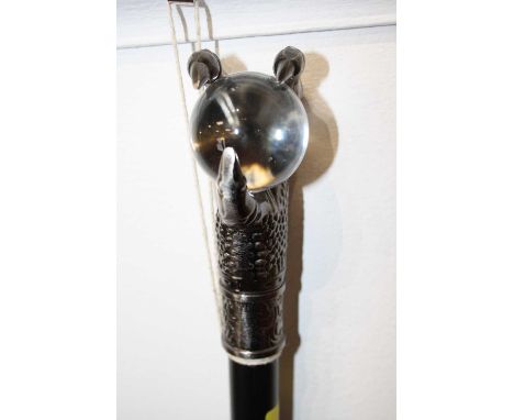 A modern walking stick, the handle in the form of a claw on glass ball, 88cm