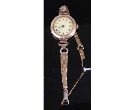 A lady's vintage 9ct gold cased manual wind wristwatch, on replacement gilt metal bracelet 