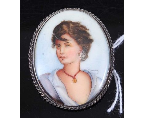 A continental porcelain portrait brooch, in white metal mount, 42 x 34mm