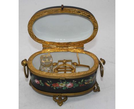 A Continental hard paste porcelain and gilt metal mounted casket, of oval form, the hinged cover transfer printed with a cher