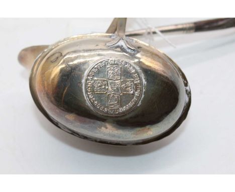 A 19th century white metal toddy ladle, having oval shaped bowl inset with a George III silver shilling, on turned whalebone 