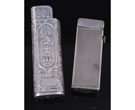 A Dunhill engine turned silver plated pocket cigarette lighter; together with a reproduction Eastern white metal cigarette li