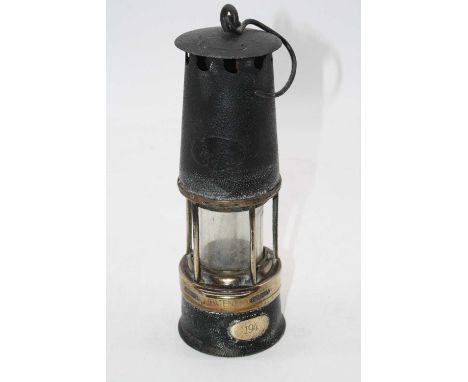 An early 20th century miner's safety lamp, the brass plaque numbered 194, h.29cm (excluding handle)