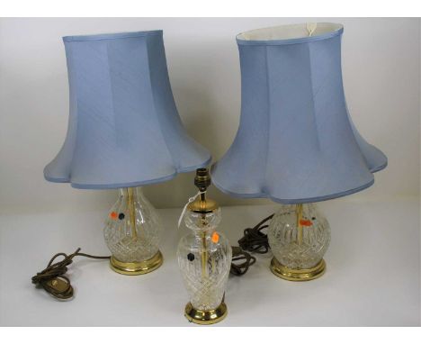 A pair of Stuart crystal table lamps, each having a blue silk shade, height 56cm each including the shades, together with ano