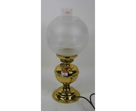 A late Victorian brass oil lamp (converted) 44cm high including shade