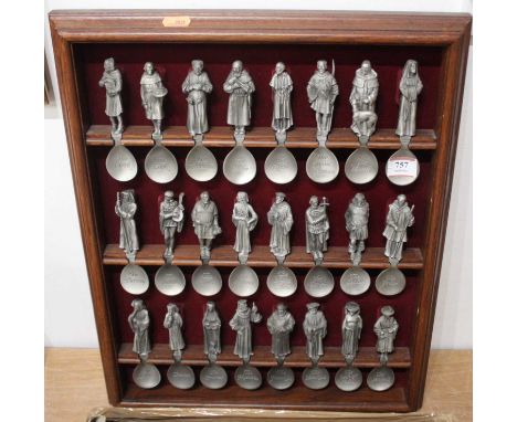 A collection of Franklin Mint Canterbury Tales spoons, and a wall mounted display shelf