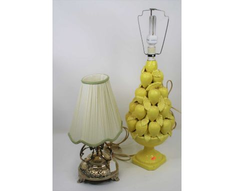 A 20th century yellow glazed pottery table lamp, in the form of a bowl of lemons, height 70cm including fittings, together wi